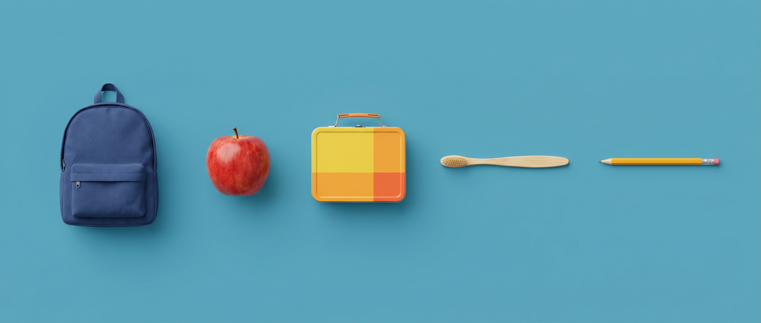 Navy school backpack, red apple, lunchbox, bamboo toothbrush and pencil on a mid-blue background